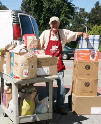 volunteers bringing in donated food items
